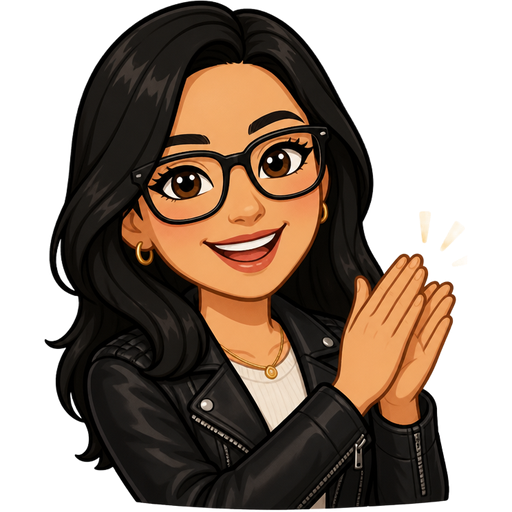 light tan woman with black hair and glasses wearing a light top and leather jacket clapping with her hands