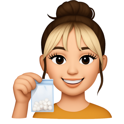 Pretty girl with long eyelashes, hair in a messy bun with bleach blonde curtain bangs smiling and holding a ziplock baggie with small white rocks