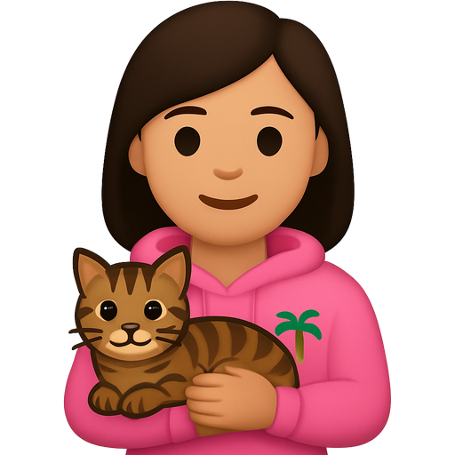 Girl with dark brown hair and pink hoodie with palm tree on hoodie holding tabby cat with brown and black fur