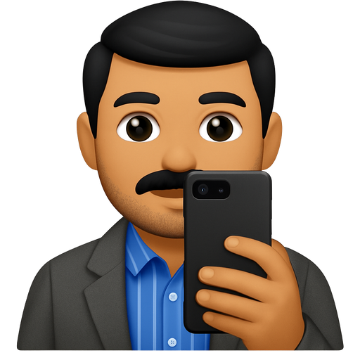A man with olive skin , black moustache and stubble, and black hair. He is wearing a royal blue dress-shirt with white vertical stripes and a grey coat over it. He is taking a selfie with a charcoal-black google pixel phone. The phone is covering his face.