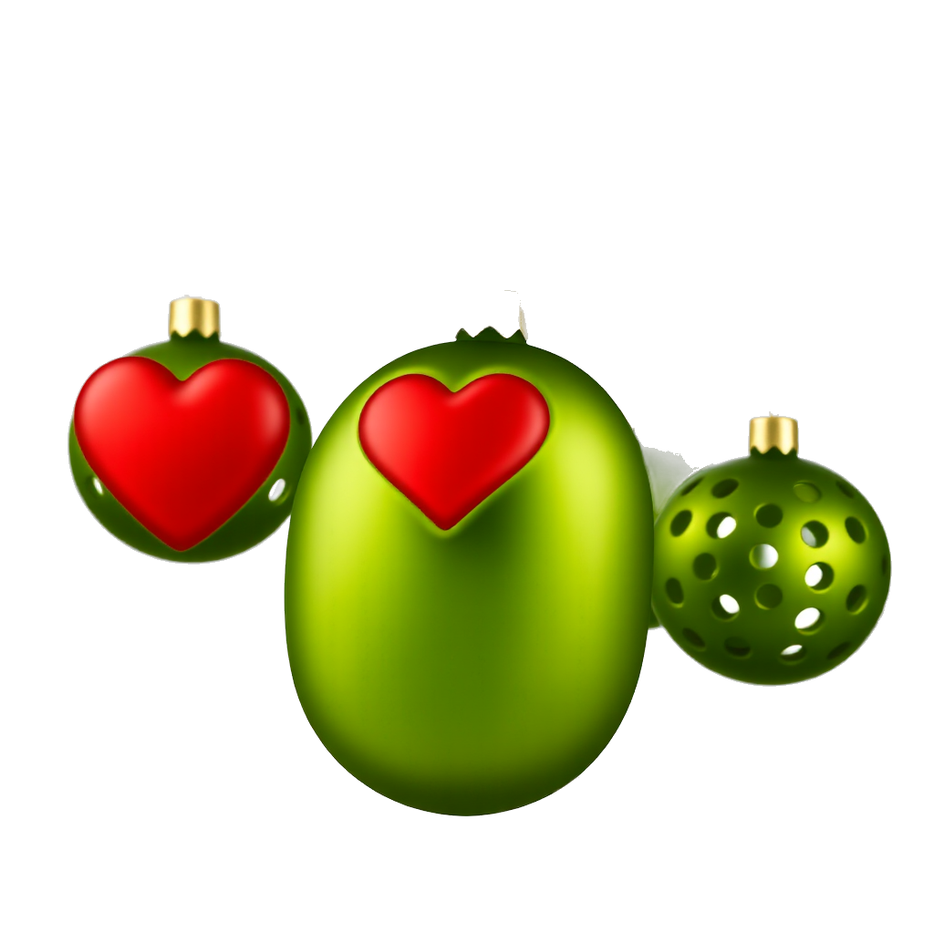 A portion of a branch of a Christmas tree is visible, and hanging from that branch are several Christmas tree ornaments made of Schlimé green pickle balls with many equally spaced holes across their surface, and one ornament that is a big red heart