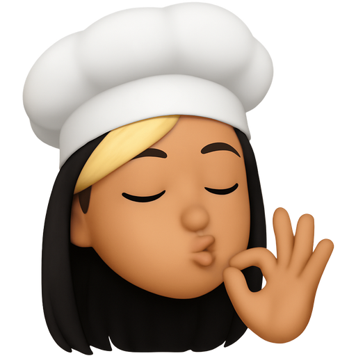 Girl with long black hair and blonde side swept bangs wearing chefs hat, eyes closed, doing the chefs kiss hands and face